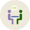 icon for think pair share showing two students talking across a table
